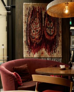 red couch beside the wooden table