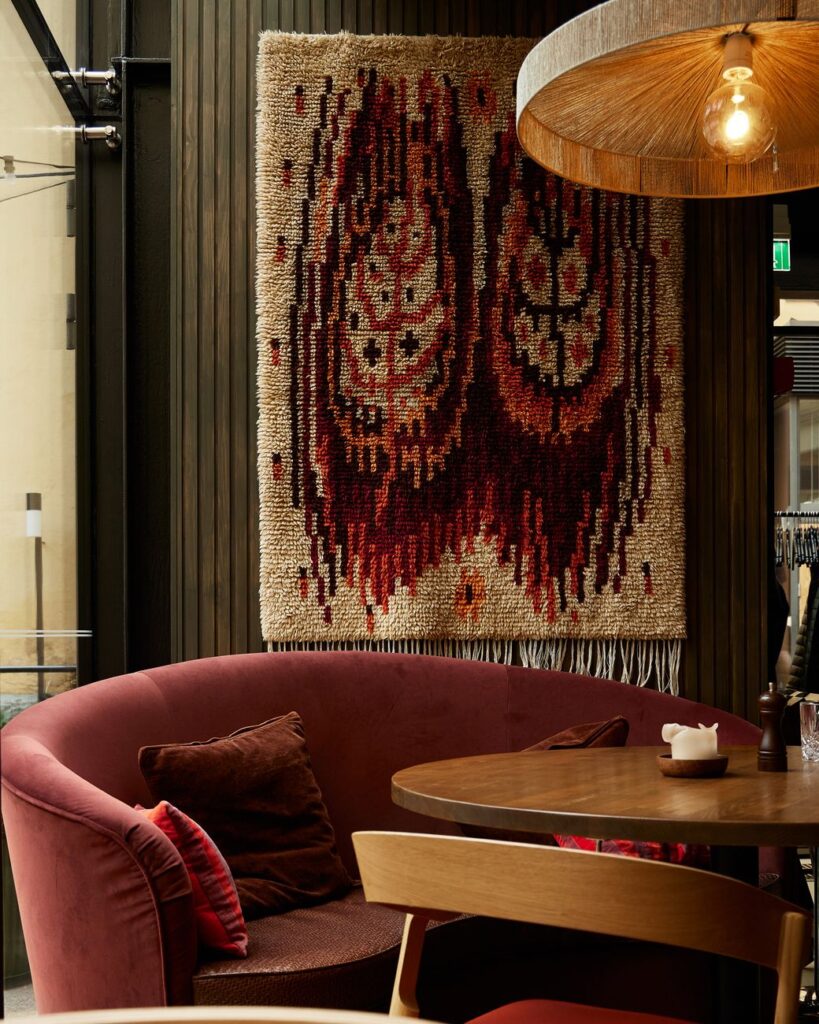 red couch beside the wooden table
